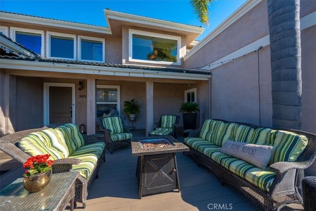 The spacious front deck is a great place to visit with friends and neighbors | Image 7
