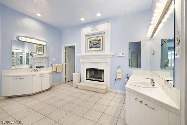 Bathroom with vanity and tile patterned floors | Image 19