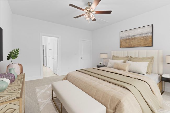 Wide angle showcases the primary suite’s layout, with direct access to the luxurious en-suite bath and plenty of room for a full bedroom furniture set. *Virtually Staged* **Image Representative of Plan Only and May Vary as Built**. | Image 18