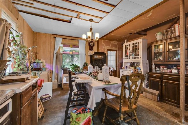 Dining area featuring a chandelier | Image 11