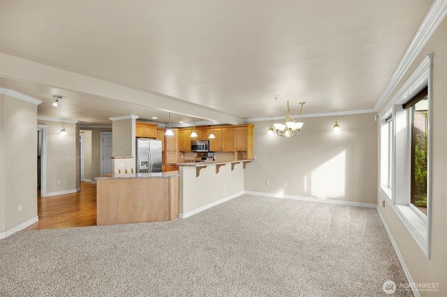 Spacious dining space with eating bar. | Image 8