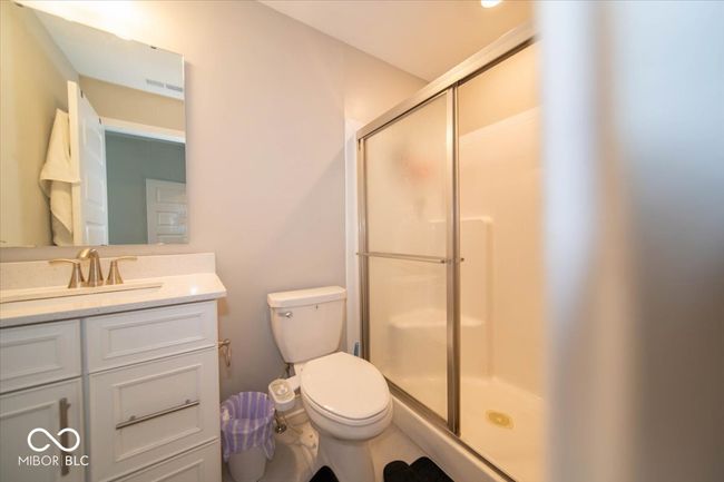 full bathroom with a stall shower and vanity | Image 14