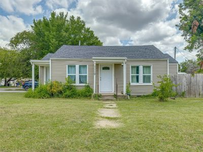 View of front of house featuring a front lawn | Image 1