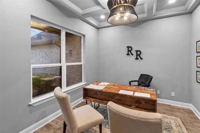 Office featuring wood finished floors, coffered ceiling, crown molding, and beam ceiling | Image 6