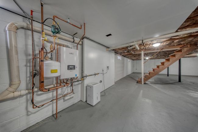 Unfinished below grade area with water heater and stairway | Image 27