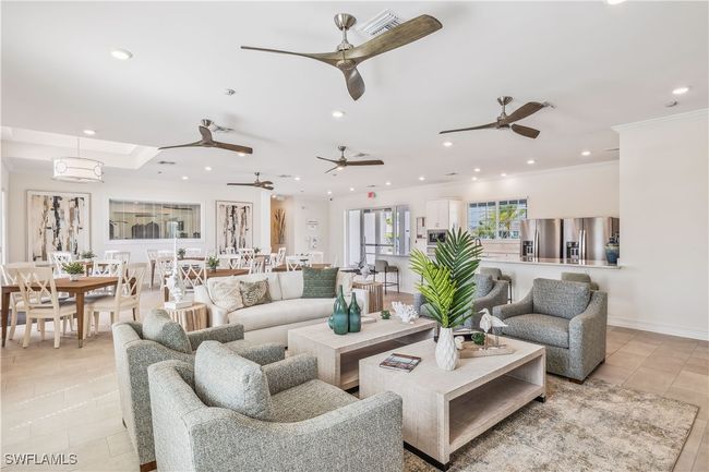 Living room with crown molding and light tile patterned floors | Image 4