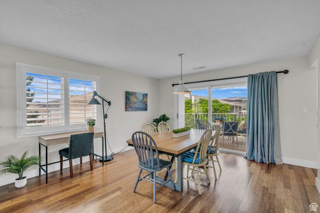 Dining area with wood finished floors and baseboards | Image 9