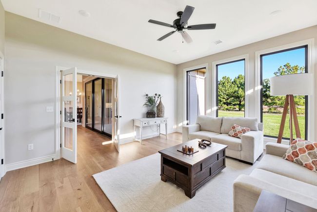 Living room featuring ceiling fan and light wood-type flooring | Image 20
