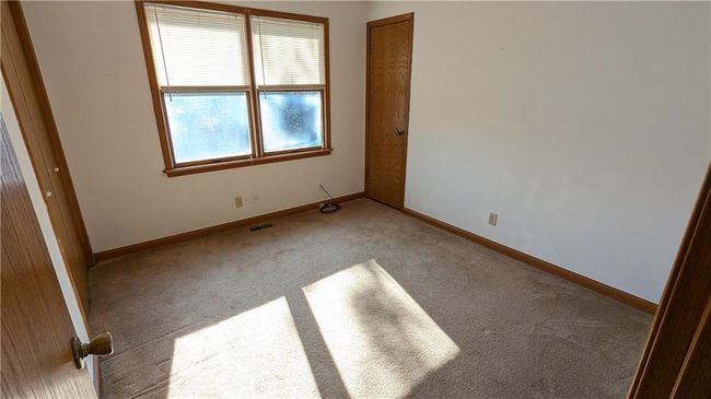 View of carpeted spare room | Image 22