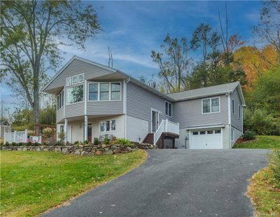 View of front of house with a front lawn and a garage | Image 2