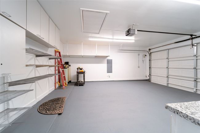 Garage with electric panel and a garage door opener | Image 37