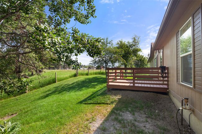 View of green lawn with a deck | Image 29