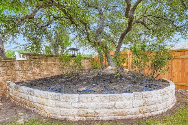 View of fenced backyard | Image 30