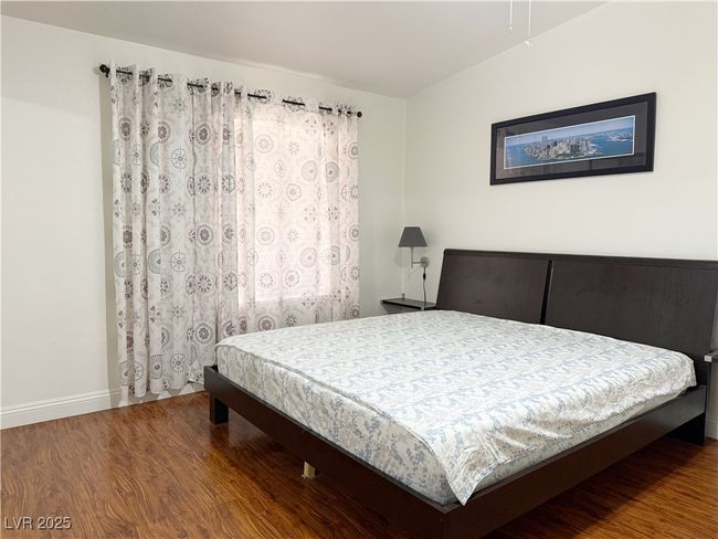 Bedroom featuring wood finished floors and baseboards | Image 28