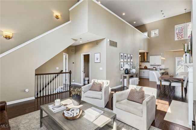 Open living space showing dining area and staircase to lower level. | Image 8