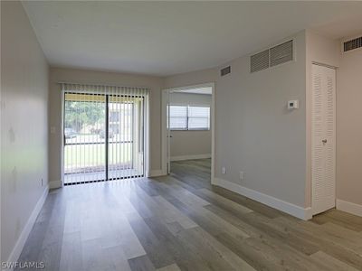 Empty room with hardwood / wood-style floors | Image 2