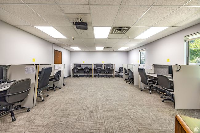 Office area with carpet flooring and a drop ceiling | Image 21