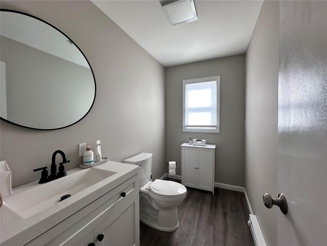 Bathroom with wood finished floors and vanity | Image 22