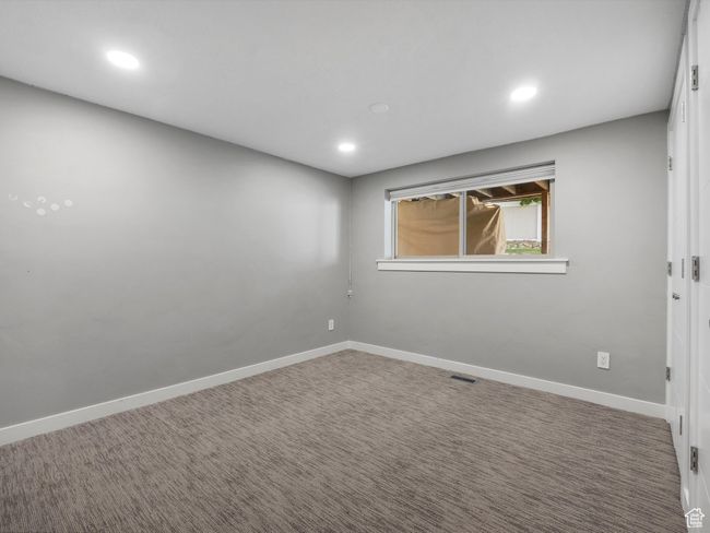 Carpeted empty room featuring recessed lighting | Image 36