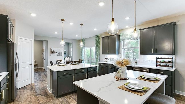 The countertop space with two islands gives so much flexibility! Use one for cooking, and one for serving. Or one for cooking, and one for congregating. Or one for kitchen prep, one for homework. Maximize the space for your needs and lifestyle! | Image 7