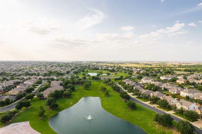 Aerial perspective of suburban area featuring a large body of water | Image 29