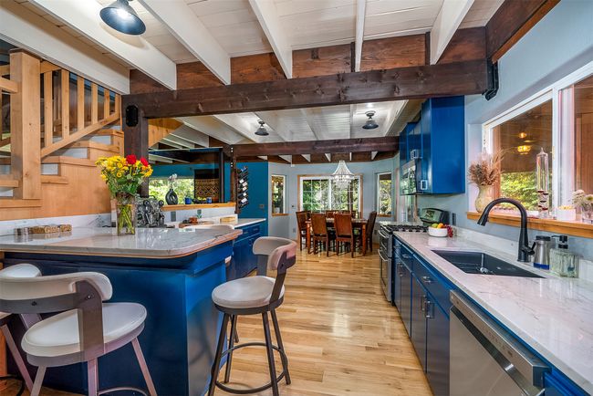 Counter seating, Carrara granite, white pine floors | Image 16