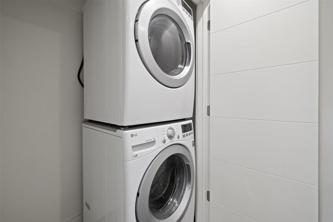 Washroom with estacked washer and dryer | Image 18