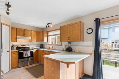 228 Quigley Close, Home with 3 bedrooms, 2 bathrooms and 2 parking in Cochrane AB | Image 3