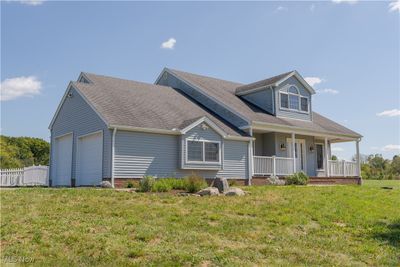 View of front facade with a side load garage | Image 3