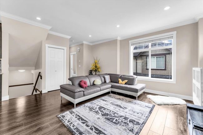 Living room featuring wood finished floors, recessed lighting, and ornamental molding | Image 10