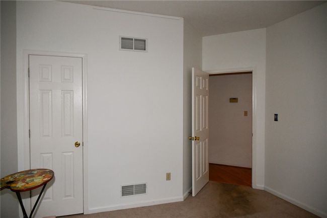 closet wraps around the wall in this room | Image 36