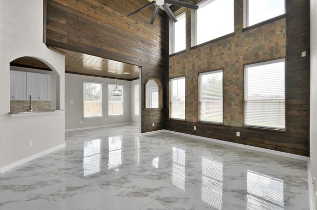 Living Area. Breakfast area ahead. Lots of windows to brighten the home. | Image 12