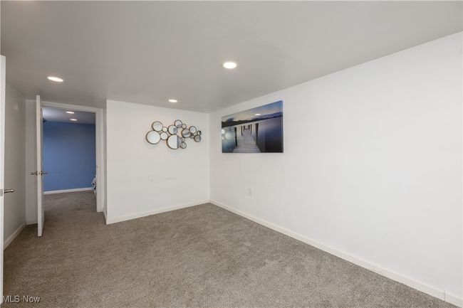 Carpeted spare room with recessed lighting and baseboards | Image 15