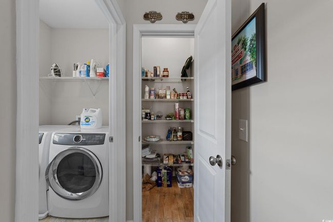 Washroom with wood finished floors | Image 11