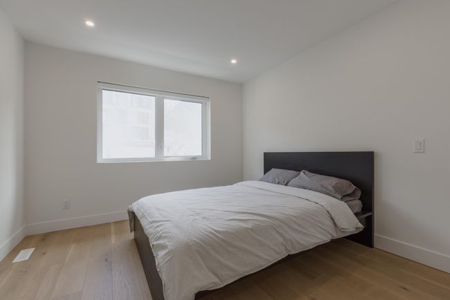 Bedroom featuring recessed lighting, light wood-type flooring, and baseboards | Image 25