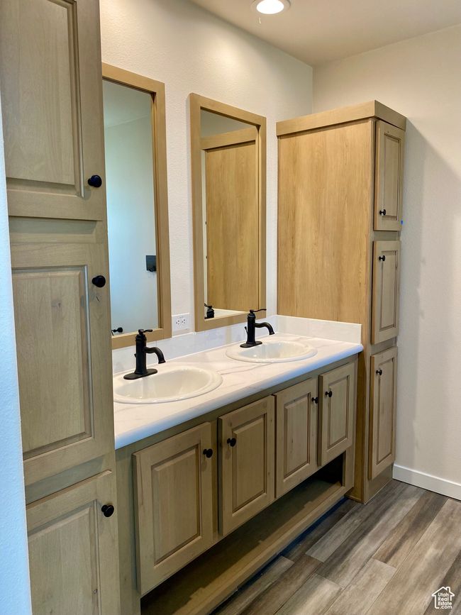 Full bathroom with double vanity, wood finished floors, and recessed lighting | Image 10