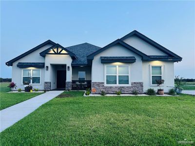 View of front of property featuring a front yard | Image 1