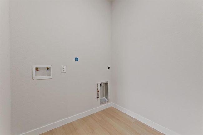 Upstairs utility room. A convenient space for laundry, keeping your home organized and efficient. | Image 11