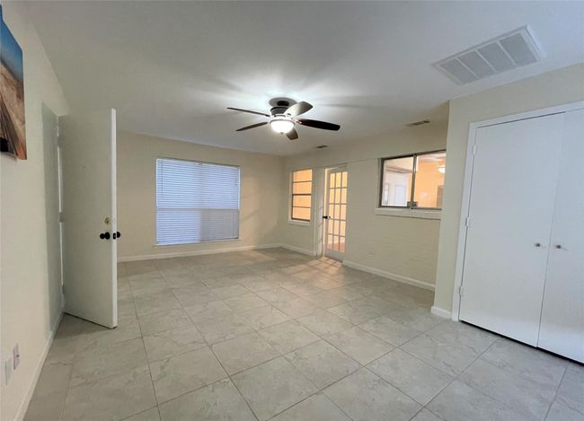 Unfurnished bedroom with baseboards and ceiling fan | Image 14