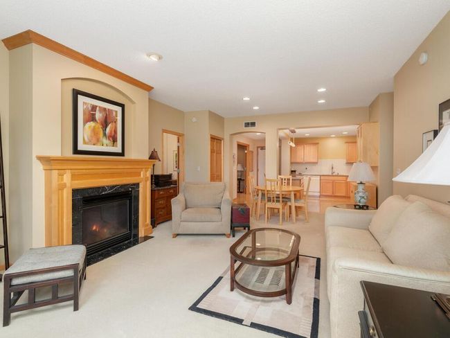 Living room open to informal dining and kitchen. | Image 6