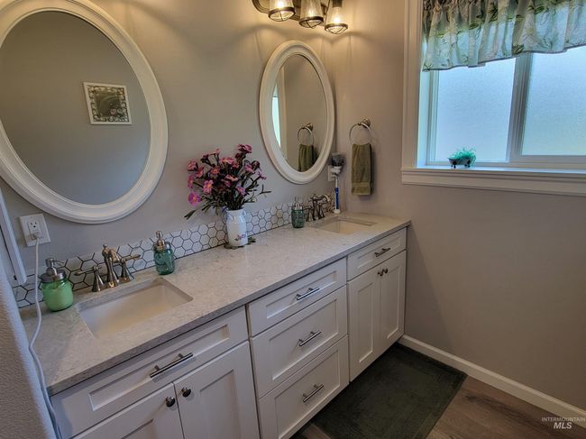 Full bathroom with double vanity and wood finished floors | Image 19