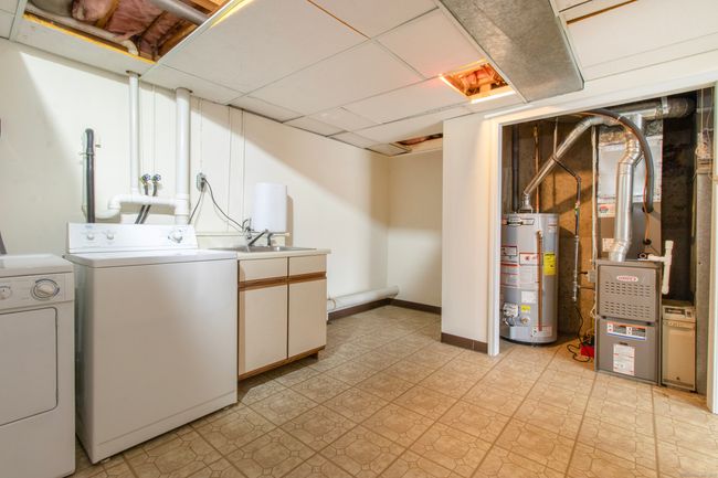 Laundry room with utility closet | Image 20