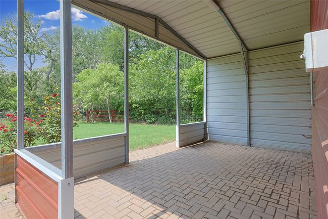 View of unfurnished sunroom | Image 30