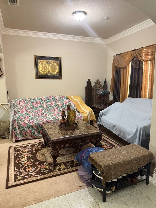 Bedroom with ornamental molding and arched walkways | Image 10