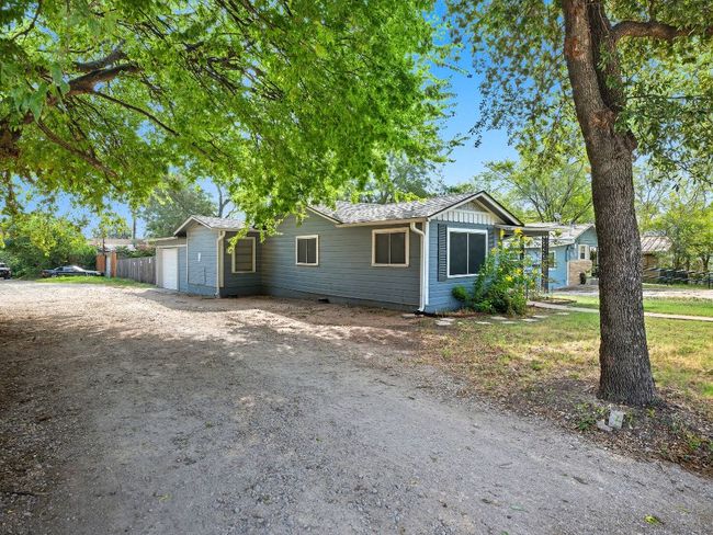 Single story home with driveway, a garage, and crawl space | Image 9