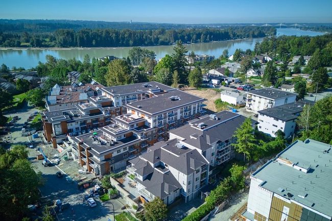 Drone / aerial view with a water view and a wooded view | Image 15