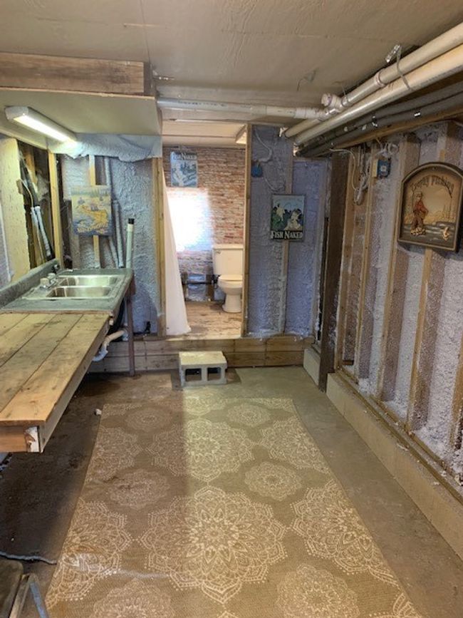3rd full bath / storage area under house | Image 15