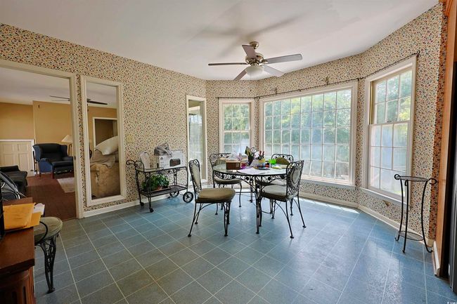 Sunroom featuring plenty of natural light | Image 9