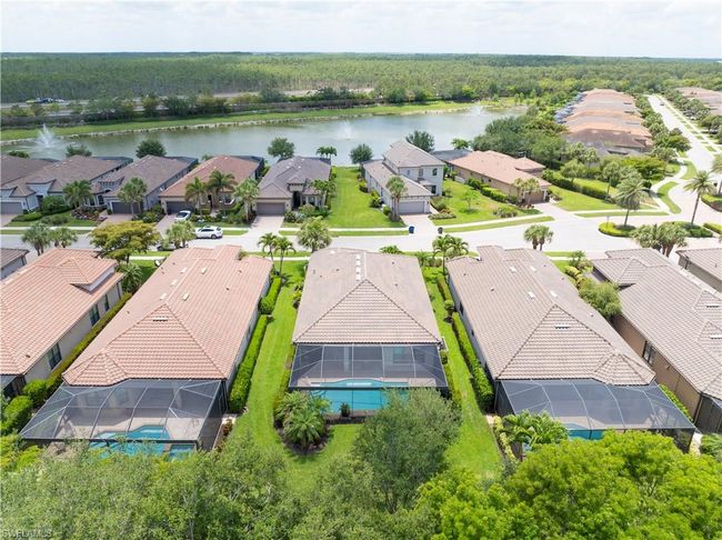 Aerial view of residential area with a nearby body of water | Image 35