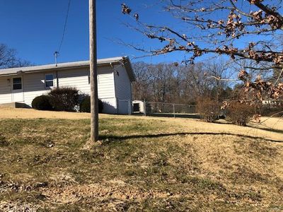 View of property exterior with a yard | Image 2